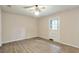 Well-lit bedroom showcasing wood floors and a door to the outside at 3812 Clare Ct, Duluth, GA 30096