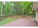 View of wooden deck overlooking lush greenery at 3812 Clare Ct, Duluth, GA 30096