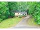 Charming home with a well-manicured lawn and long driveway at 3812 Clare Ct, Duluth, GA 30096