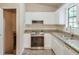 Bright kitchen features stainless steel oven, ample cabinet space, and granite countertops at 3812 Clare Ct, Duluth, GA 30096