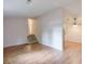 Open living area featuring wood-look floors, stairs to the upper level, and neutral walls at 3812 Clare Ct, Duluth, GA 30096