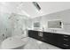 Bright main bathroom with marble finishes, double vanity, glass shower, and soaking tub at 4070 Whitewater Creek Rd, Atlanta, GA 30327