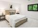Modern bedroom featuring a comfortable bed, side tables and recessed lights at 4070 Whitewater Creek Rd, Atlanta, GA 30327