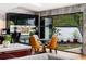 Modern dining area featuring sleek black cabinets, and views of greenery outside at 4070 Whitewater Creek Rd, Atlanta, GA 30327
