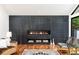 Close-up of the living room, highlighting a sleek, modern fireplace with a marble surround and hardwood floors at 4070 Whitewater Creek Rd, Atlanta, GA 30327