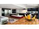Modern kitchen with stainless steel appliances, sleek cabinetry, and a center island with seating, open to the living room at 4070 Whitewater Creek Rd, Atlanta, GA 30327