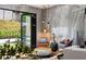 Cozy living room area with comfortable seating, and an open view to the landscaped yard at 4070 Whitewater Creek Rd, Atlanta, GA 30327