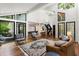 Bright living room with high ceilings, floor-to-ceiling windows, and a staircase at 4070 Whitewater Creek Rd, Atlanta, GA 30327