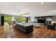 Open concept living area with modern kitchen, stylish furniture, and outdoor access at 4070 Whitewater Creek Rd, Atlanta, GA 30327