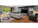 Open living room features built-in shelving, modern decor, and sliding glass doors to a landscaped backyard at 4070 Whitewater Creek Rd, Atlanta, GA 30327