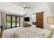 Bright main bedroom with sliding glass doors to the backyard, an ensuite, and a barn door at 4070 Whitewater Creek Rd, Atlanta, GA 30327