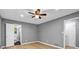 Spacious bedroom featuring hardwood floors with an ensuite bathroom and a ceiling fan at 4260 Bonaparte Dr, Tucker, GA 30084