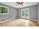 Cozy bedroom featuring hardwood floors and access to a private balcony at 4260 Bonaparte Dr, Tucker, GA 30084