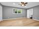 Bedroom with hardwood floors, a ceiling fan, and a view of the backyard at 4260 Bonaparte Dr, Tucker, GA 30084