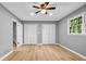 Bedroom featuring hardwood floors, two closets, and a window providing natural light at 4260 Bonaparte Dr, Tucker, GA 30084