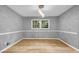 Elegant dining room with hardwood floors and a modern light fixture at 4260 Bonaparte Dr, Tucker, GA 30084