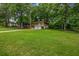 Beautiful home with a well-manicured front lawn and mature trees at 4260 Bonaparte Dr, Tucker, GA 30084