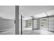 Spacious garage with a concrete floor and a view of the neighborhood through the garage door windows at 4260 Bonaparte Dr, Tucker, GA 30084