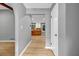 Inviting hallway with hardwood floors leading to a bright, updated kitchen at 4260 Bonaparte Dr, Tucker, GA 30084