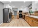 Updated kitchen featuring white cabinets, stainless appliances, and wooden accents at 4260 Bonaparte Dr, Tucker, GA 30084