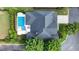 Aerial view of a home, showcasing the roof, backyard pool, and surrounding landscaping at 904 Urban Ash Ct, Johns Creek, GA 30022