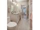 Stylish bathroom with double sinks, a sleek vanity, and a glass-enclosed shower, designed for convenience and comfort at 904 Urban Ash Ct, Johns Creek, GA 30022