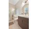 Modern bathroom with a sleek vanity, round mirror, and glass-enclosed shower, creating a spa-like retreat at 904 Urban Ash Ct, Johns Creek, GA 30022
