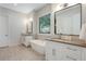 Bathroom with dual vanity, soaking tub, tile floors, and modern fixtures at 904 Urban Ash Ct, Johns Creek, GA 30022