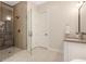 Modern bathroom with a glass shower and vanity at 904 Urban Ash Ct, Johns Creek, GA 30022