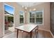 Dining area with a view to a patio and a table set for four at 904 Urban Ash Ct, Johns Creek, GA 30022