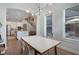 Open concept dining room with view into kitchen and staircase at 904 Urban Ash Ct, Johns Creek, GA 30022
