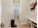 Bright hallway with hardwood floors, shoe rack, and coat hooks at 904 Urban Ash Ct, Johns Creek, GA 30022