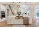 Spacious kitchen with a large island, stainless steel appliances, and open floor plan at 904 Urban Ash Ct, Johns Creek, GA 30022