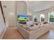 Bright living room with vaulted ceilings, fireplace, built-in shelving, and hardwood floors at 904 Urban Ash Ct, Johns Creek, GA 30022