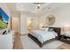 Cozy main bedroom with tray ceiling and access to the bathroom at 904 Urban Ash Ct, Johns Creek, GA 30022
