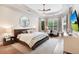 Main bedroom with trey ceiling, bay window, sitting area, and hardwood floors at 904 Urban Ash Ct, Johns Creek, GA 30022