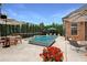 Backyard pool with a spa, patio furniture, and lush landscaping perfect for outdoor relaxation at 904 Urban Ash Ct, Johns Creek, GA 30022