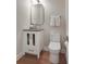 Classic powder room featuring a vanity, mirror, and toilet at 904 Urban Ash Ct, Johns Creek, GA 30022