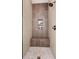 Luxurious shower with tiled walls, a built-in bench, and a shower niche at 904 Urban Ash Ct, Johns Creek, GA 30022
