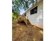 A backyard featuring wooden stairs leading to a new wood deck at 1460 Hartford Sw Ave, Atlanta, GA 30310