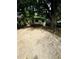 A detached house featuring a backyard with a deck, lawn, and mature trees at 1460 Hartford Sw Ave, Atlanta, GA 30310