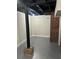 Finished basement with painted floors, support beams, and exposed brick at 1460 Hartford Sw Ave, Atlanta, GA 30310