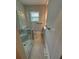 This bathroom features a glass-enclosed shower, neutral tile, and stylish towel racks at 1460 Hartford Sw Ave, Atlanta, GA 30310