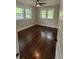 This bedroom offers natural light, hardwood flooring, and a ceiling fan for added comfort at 1460 Hartford Sw Ave, Atlanta, GA 30310