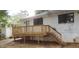 Rear exterior view of a house showing the wood deck and stairs at 1460 Hartford Sw Ave, Atlanta, GA 30310