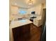 Bright, newly updated kitchen with white cabinets, quartz countertops, and stainless steel appliances, offering modern elegance at 1460 Hartford Sw Ave, Atlanta, GA 30310