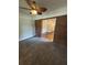Living Room features a ceiling fan, carpet, and a brick entryway at 1460 Hartford Sw Ave, Atlanta, GA 30310