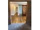 Living Room features barn door, hardwood flooring, and a brick entryway at 1460 Hartford Sw Ave, Atlanta, GA 30310