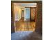 Living Room features barn door, hardwood flooring, and a brick entryway at 1460 Hartford Sw Ave, Atlanta, GA 30310
