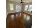 Inviting living room with dark wood floors, white trim, bright windows and lots of natural light at 1460 Hartford Sw Ave, Atlanta, GA 30310